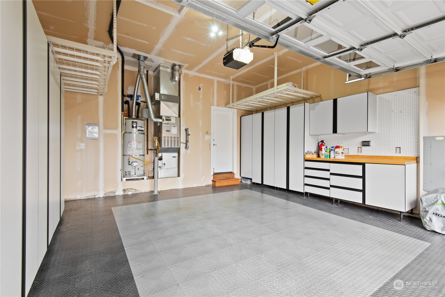 23923 Northeast Adair Road Redmond, WA 98053 - Photo 32 of 38 a storage room with wooden cabinets