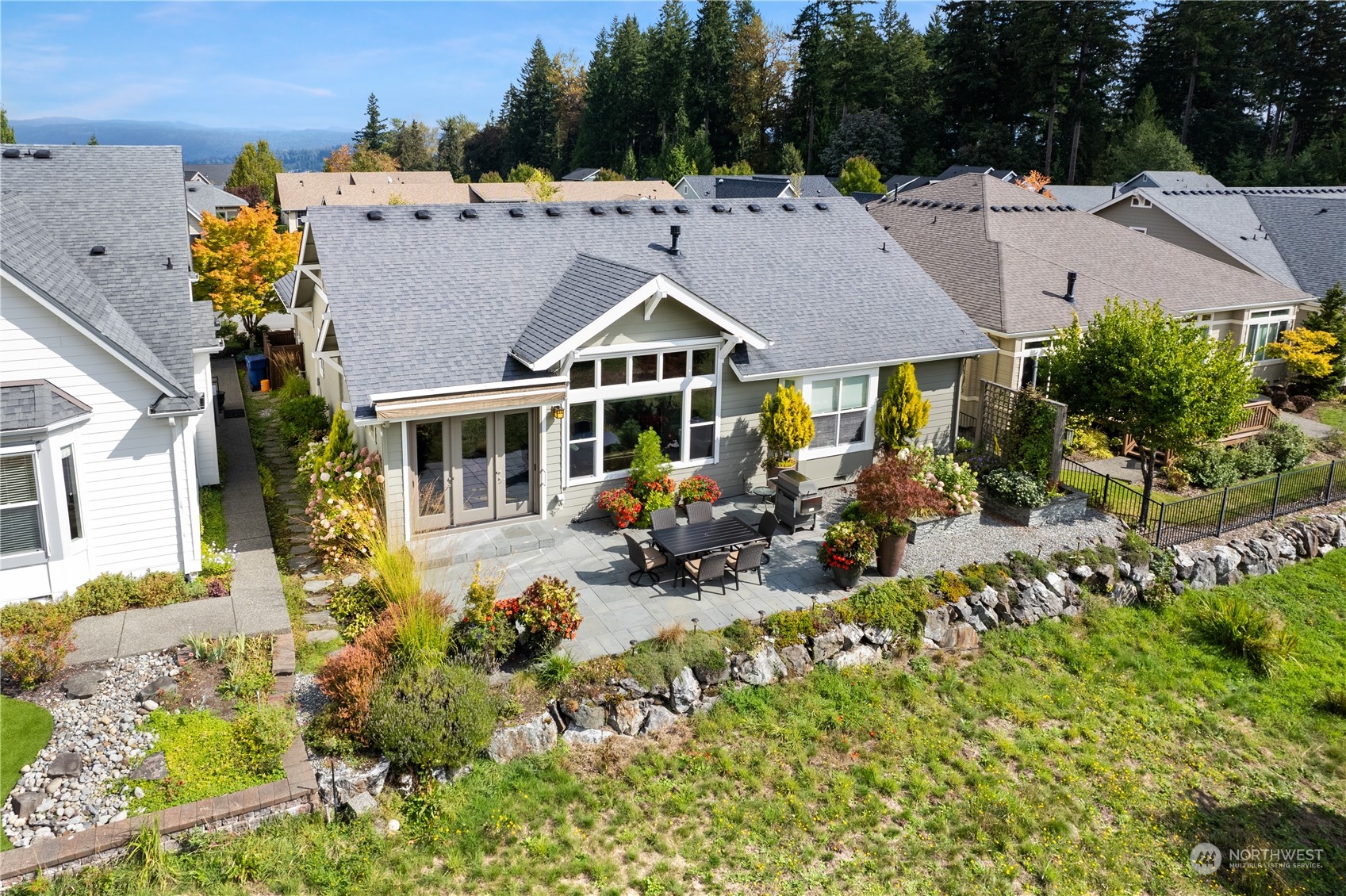 23923 Northeast Adair Road Redmond, WA 98053 - Photo 34 of 38 a view of a house with swimming pool and sitting area