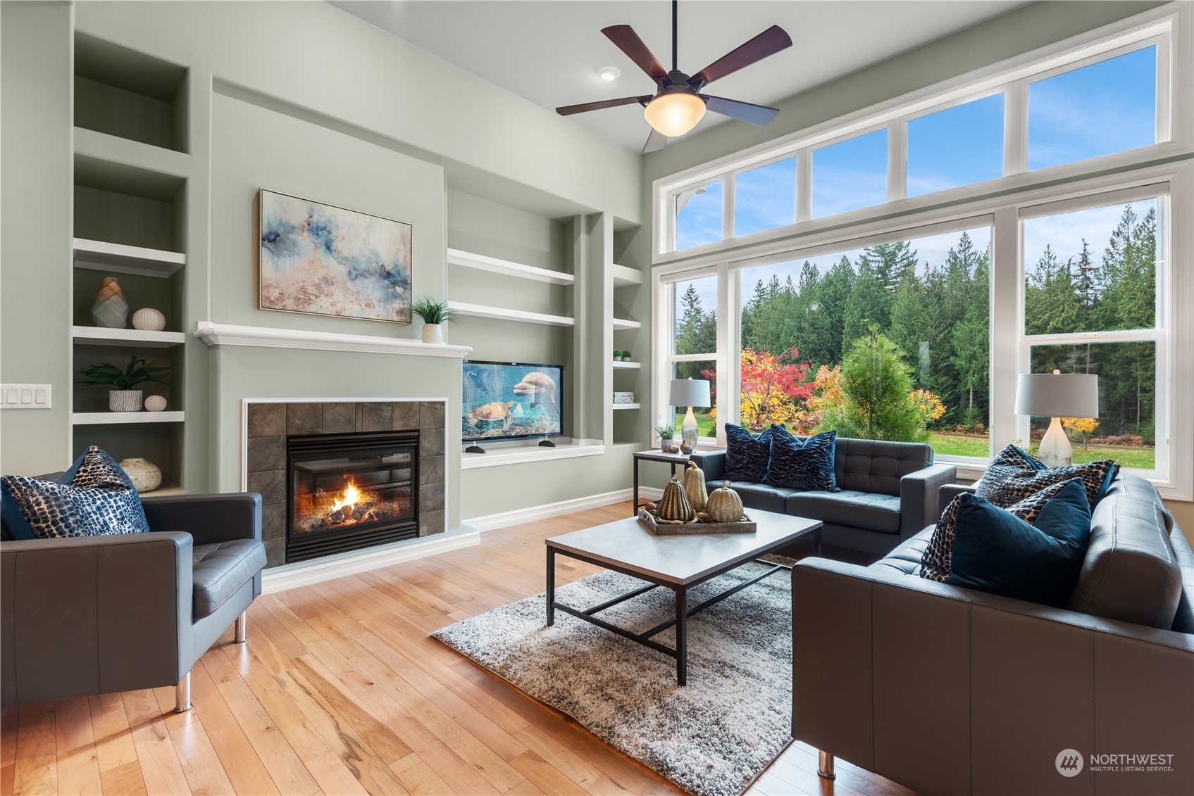 23923 Northeast Adair Road Redmond, WA 98053 - Photo 7 of 38 a living room with furniture a fireplace and a large window