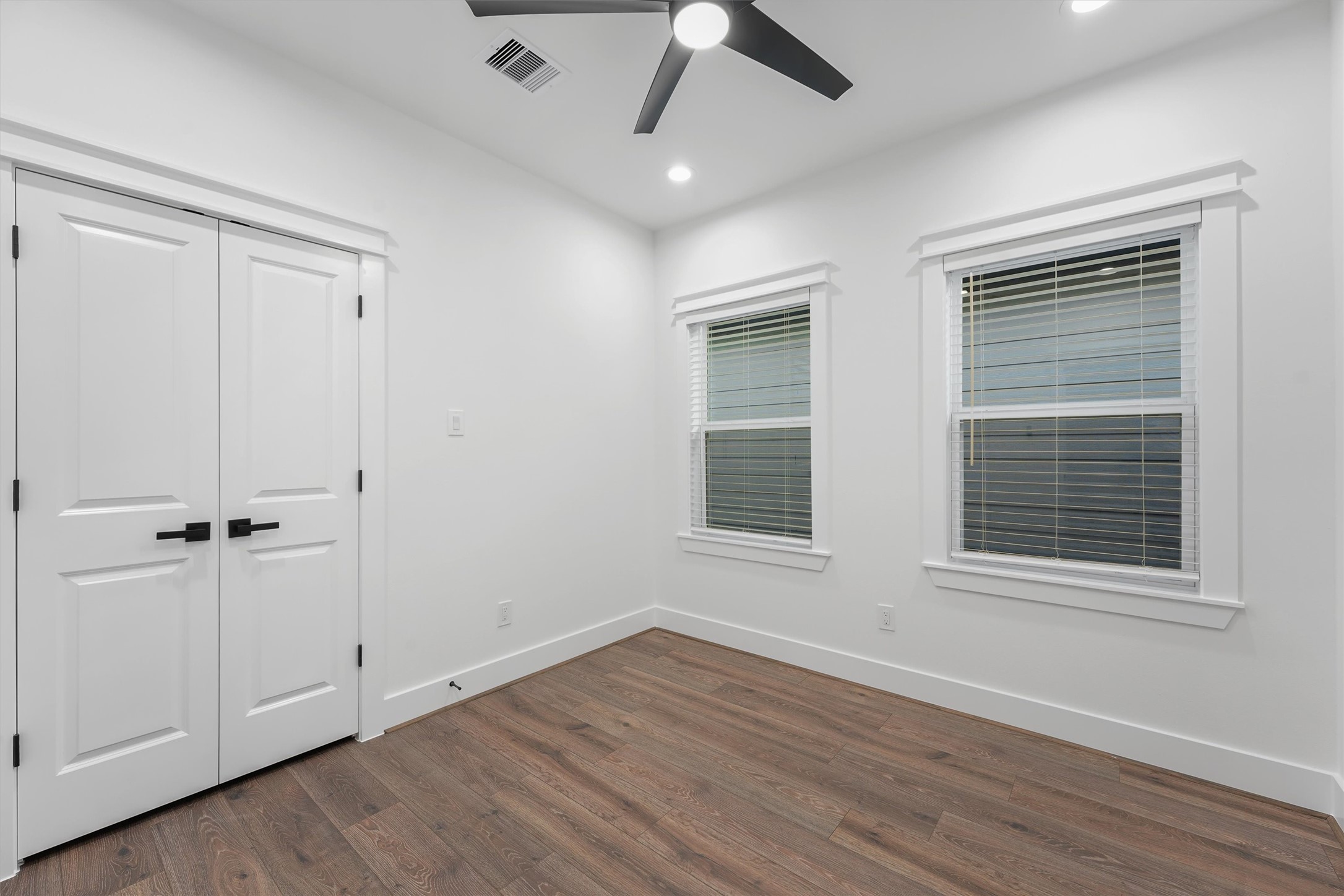 4208 Castor Street, Unit A Houston, TX 77022 - Photo 20 of 23 a view of an empty room with wooden floor and a window