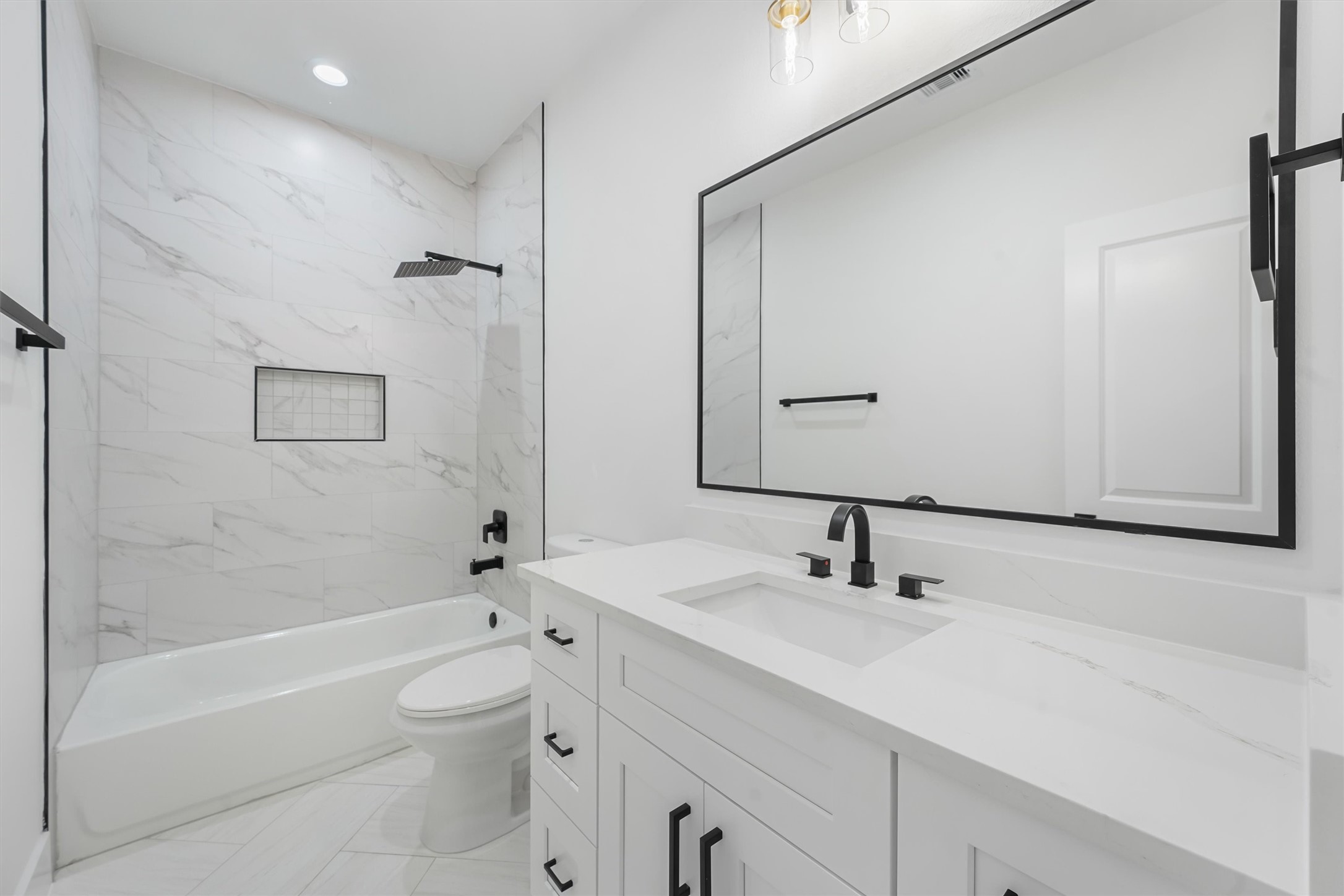 4208 Castor Street, Unit A Houston, TX 77022 - Photo 21 of 23 a bathroom with a bathtub shower sink vanity and toilet