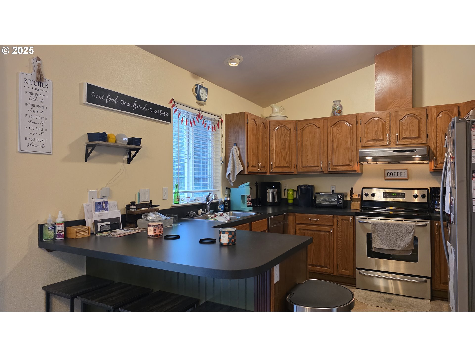 934 South 46th Street Springfield, OR 97478 - Photo 12 of 37 a kitchen with stainless steel appliances a sink stove and refrigerator