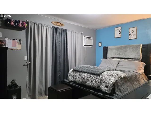 a bedroom with a bed and a cabinets