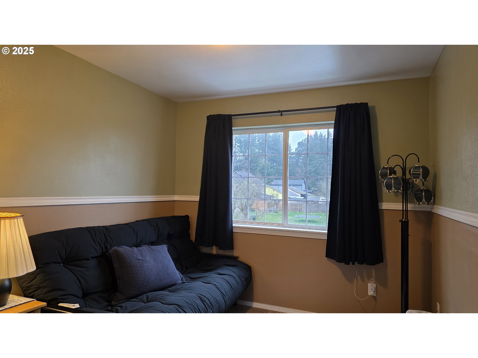934 South 46th Street Springfield, OR 97478 - Photo 16 of 37 a living room with furniture and a large window