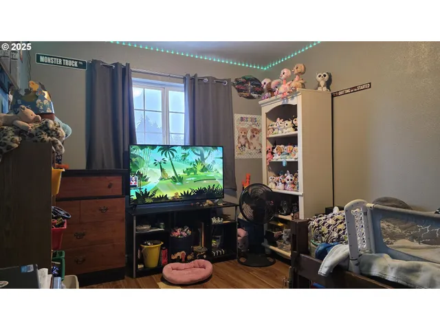 a room with furniture and a potted plant