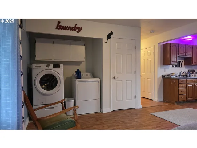 a kitchen with a refrigerator and cabinets