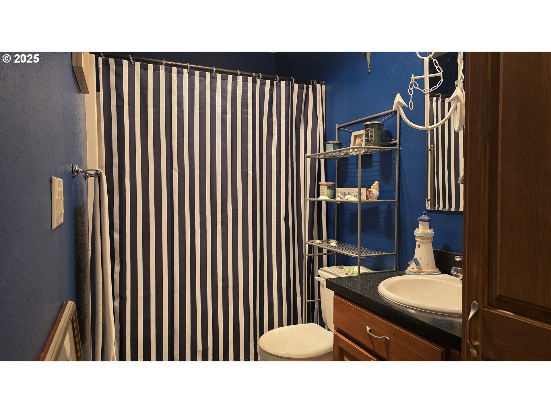 934 South 46th Street Springfield, OR 97478 - Photo 30 of 37 a bathroom with a sink a toilet and a shower