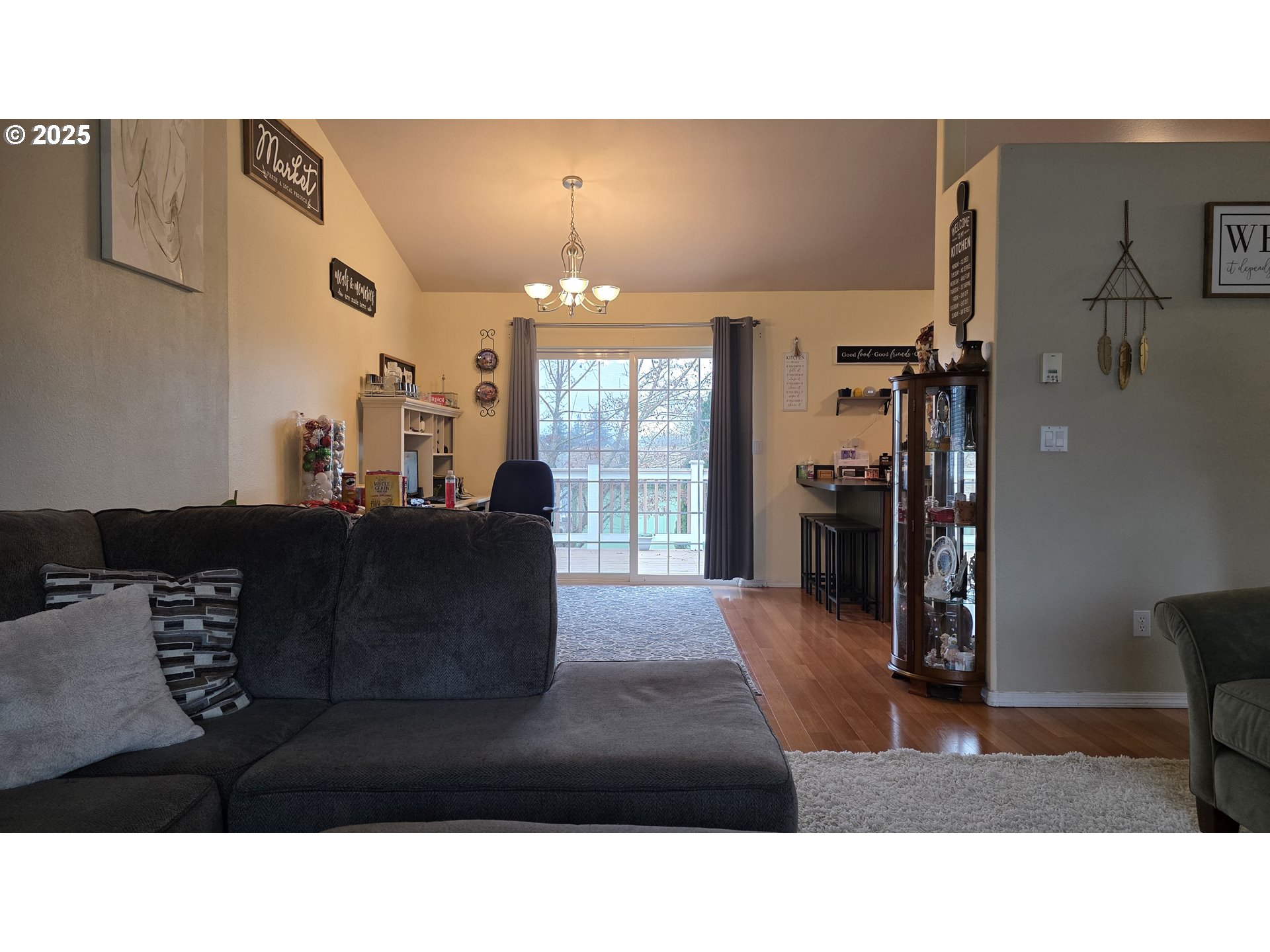 934 South 46th Street Springfield, OR 97478 - Photo 9 of 37 a living room with furniture and a chandelier