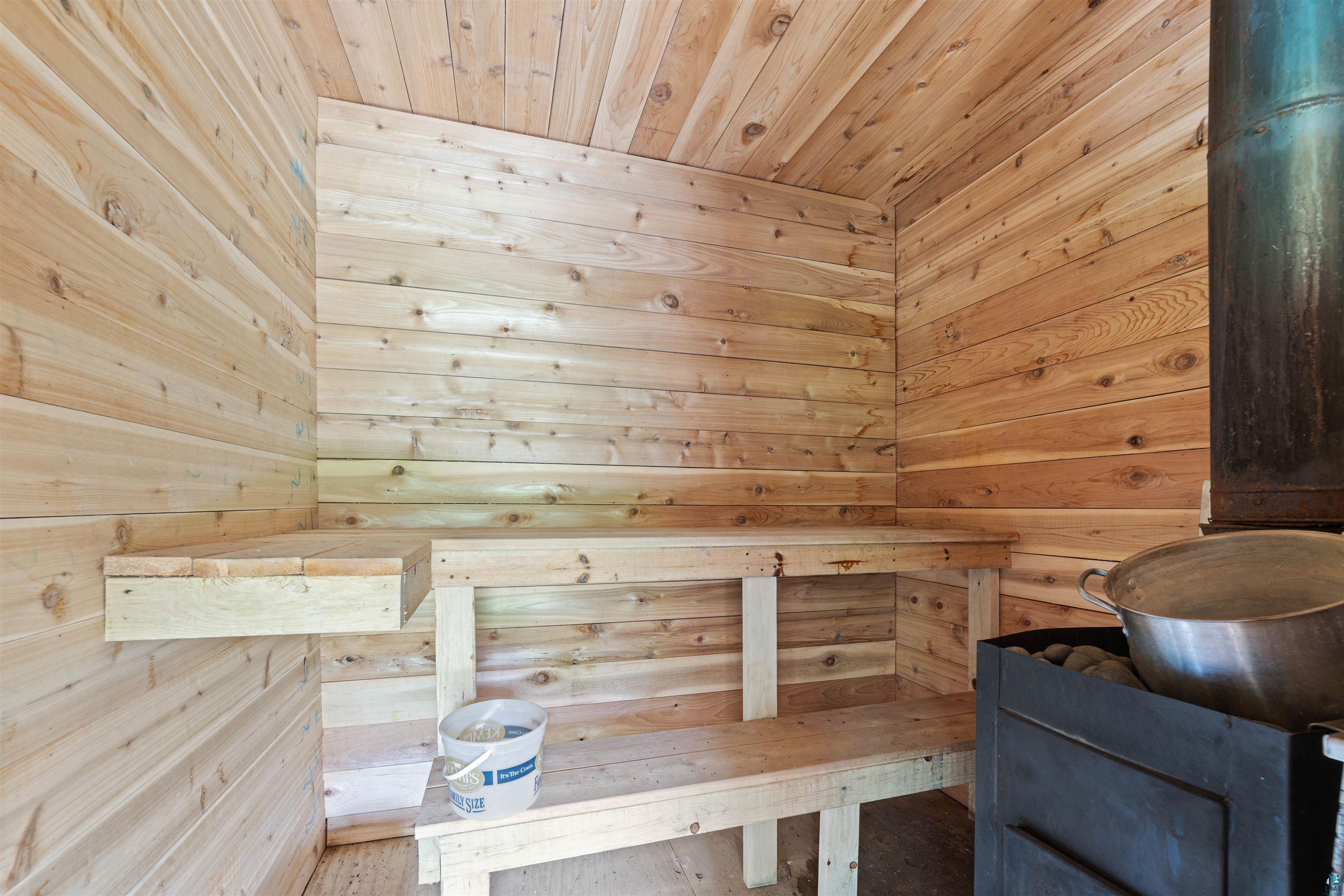7071 South Warring Road Foxboro, WI 54836 - Photo 20 of 24 View of sauna / steam room featuring wood walls