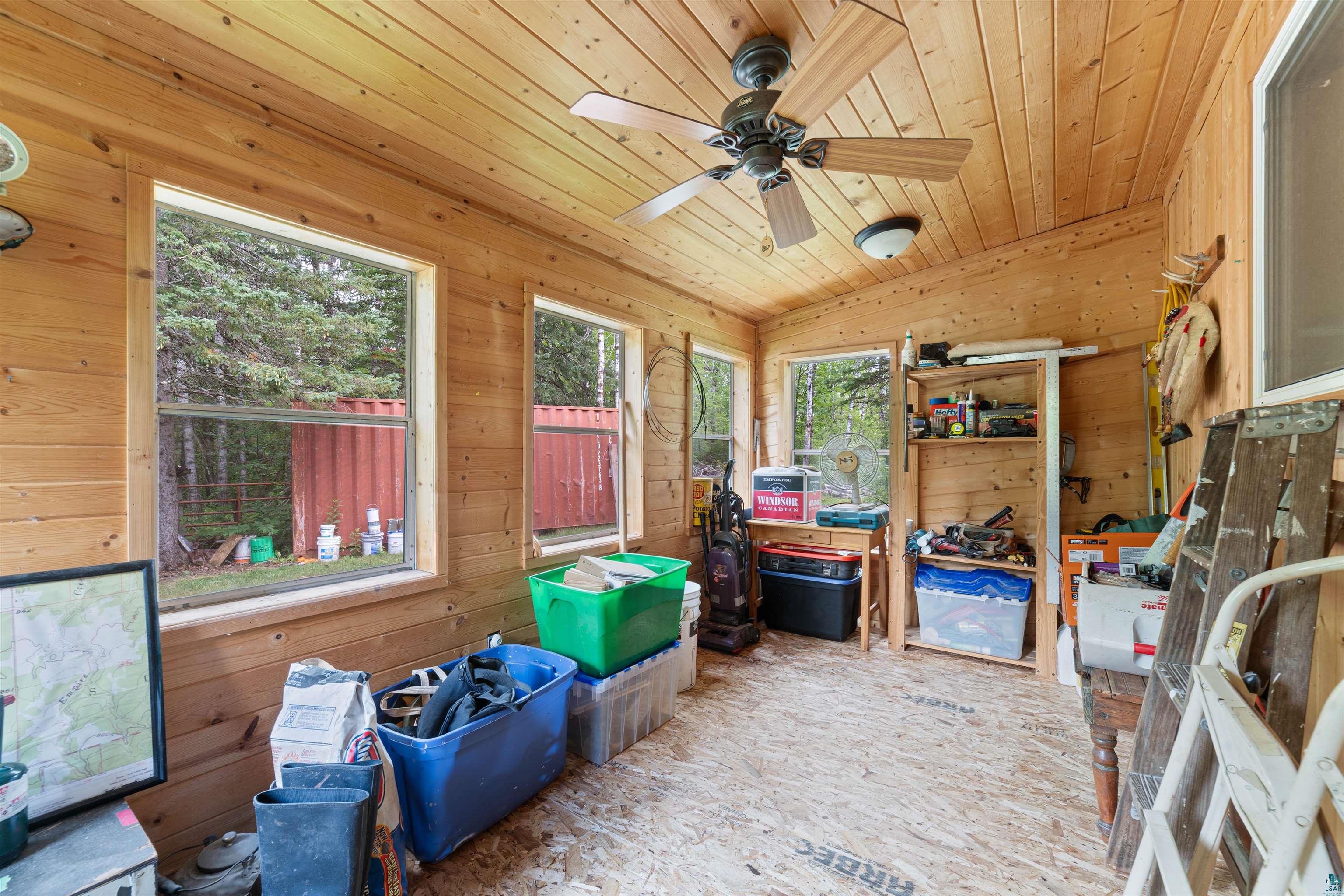 7071 South Warring Road Foxboro, WI 54836 - Photo 8 of 24 Storage room featuring ceiling fan