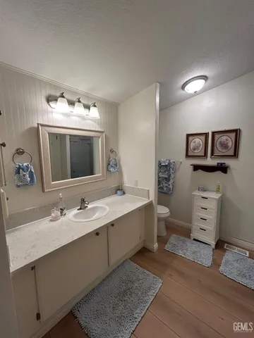 a spacious bathroom with a double vanity sink and a mirror