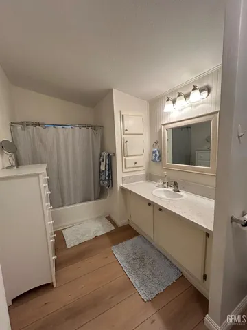 a bathroom with a sink and mirror
