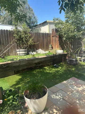 a view of a backyard with swimming pool