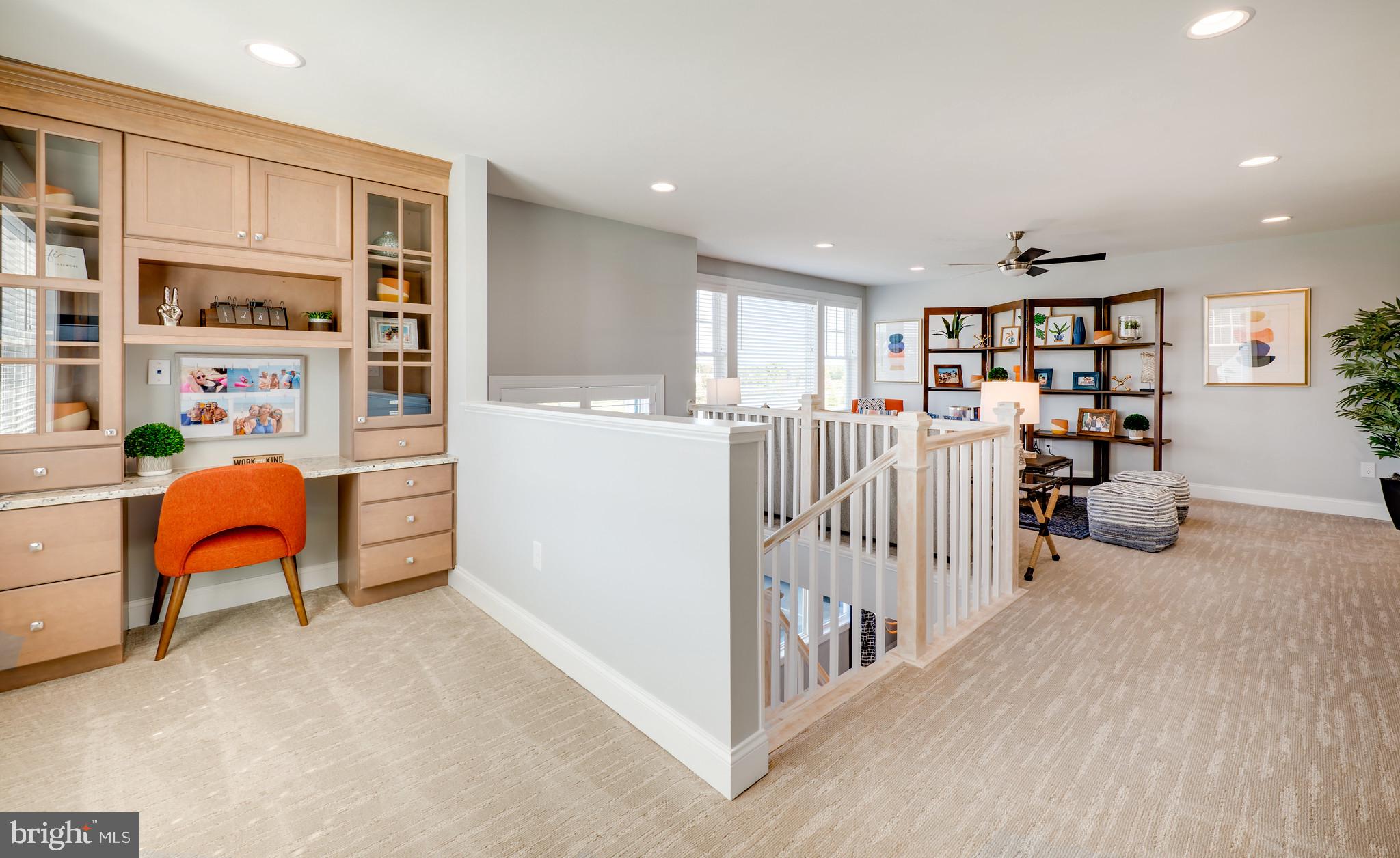 19499 Safflower Way Lewes, DE 19958 - Photo 19 of 24 a view of a livingroom with furniture and white cabinets