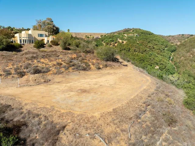 a view of a large mountain with mountains in the background
