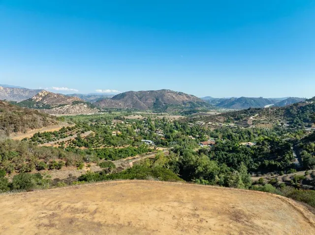 a view of a mountain with an ocean