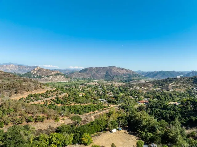 a view of a field of mountains and valleys