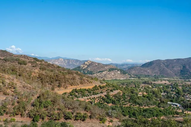 a view of a beach with a mountain