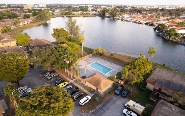 an aerial view of a house with a lake view