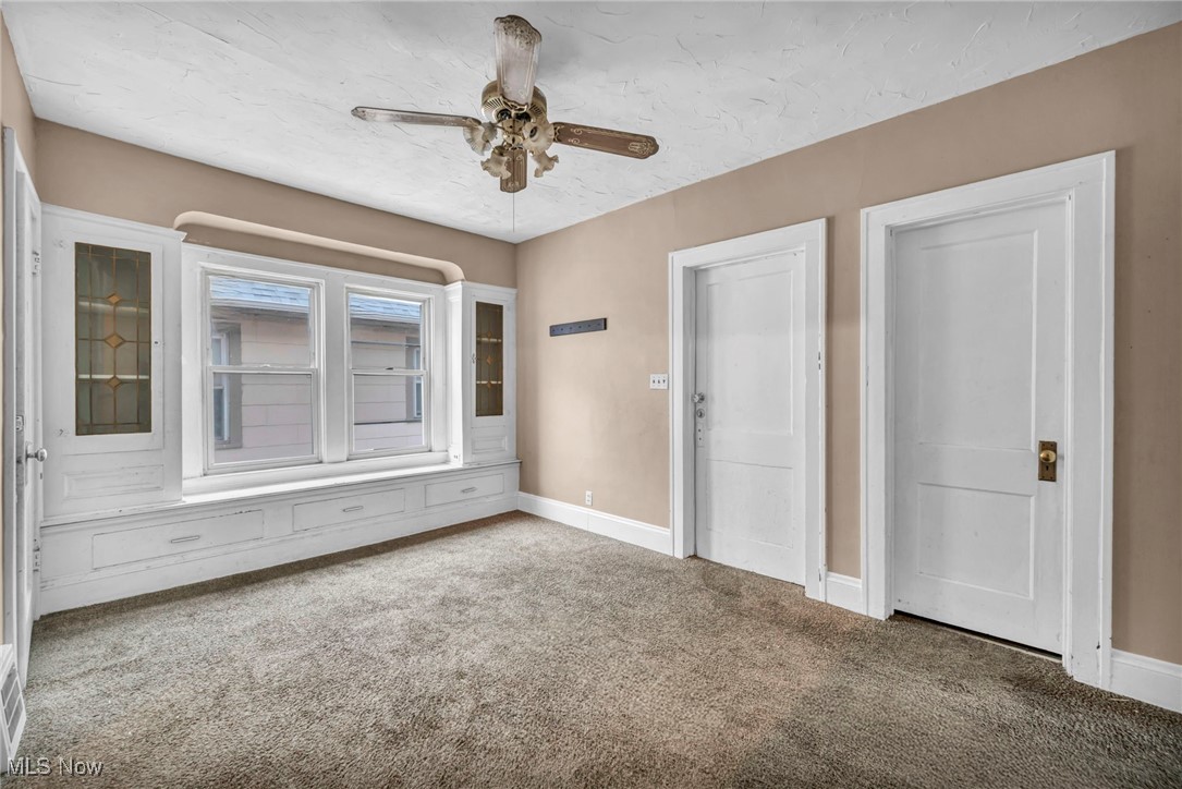 949 Rudyard Road Cleveland, OH 44110 - Photo 32 of 42 Unfurnished bedroom featuring carpet and ceiling fan