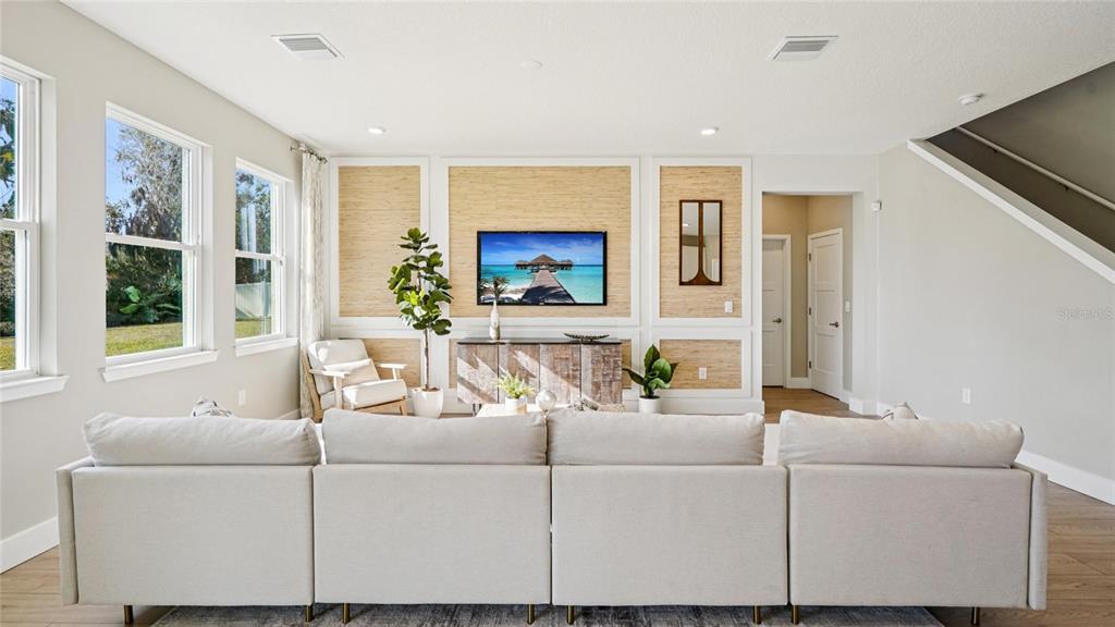 1732 Northwest 127th Street Gainesville, FL 32606 - Photo 13 of 30 a living room with furniture and a flat screen tv