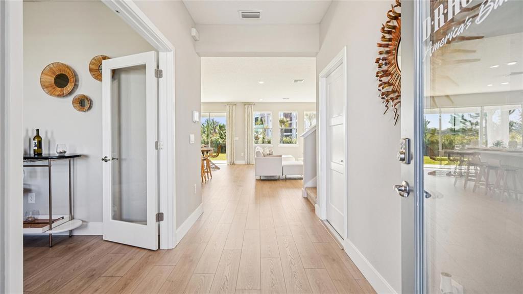 1732 Northwest 127th Street Gainesville, FL 32606 - Photo 2 of 30 a view of a hallway with wooden floor and closet
