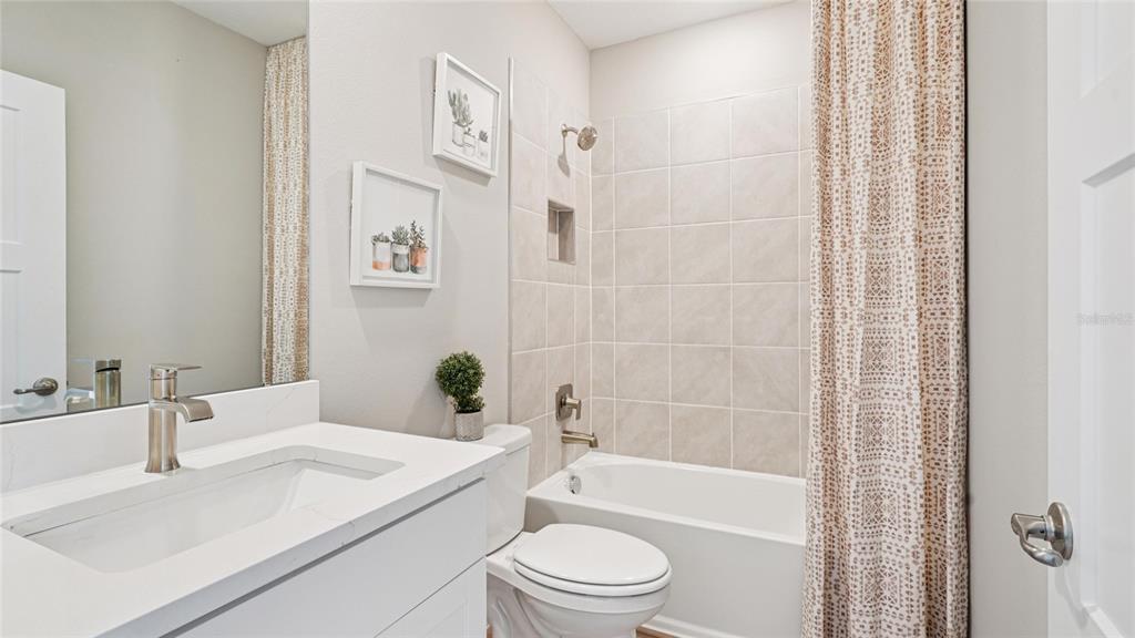 1732 Northwest 127th Street Gainesville, FL 32606 - Photo 28 of 30 a bathroom with a toilet a sink and a bathtub
