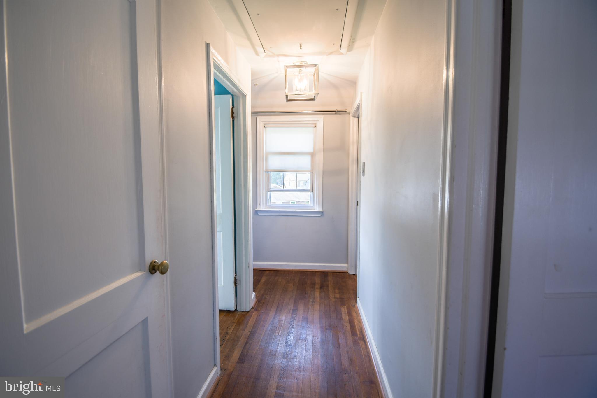 616 Wayne Avenue Springfield, PA 19064 - Photo 16 of 33 a view of hallway with wooden floor
