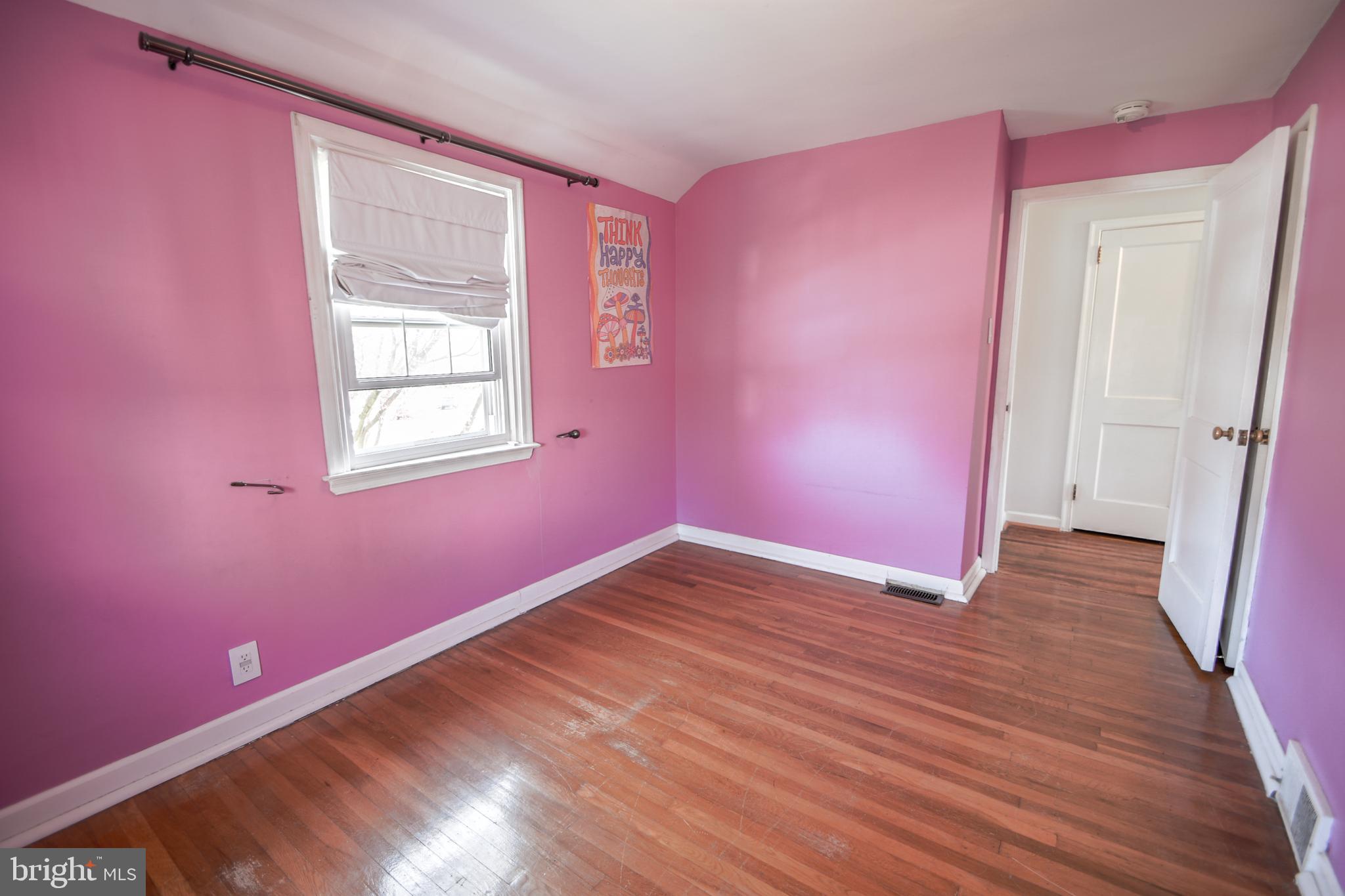 616 Wayne Avenue Springfield, PA 19064 - Photo 20 of 33 a view of empty room with wooden floor and fan