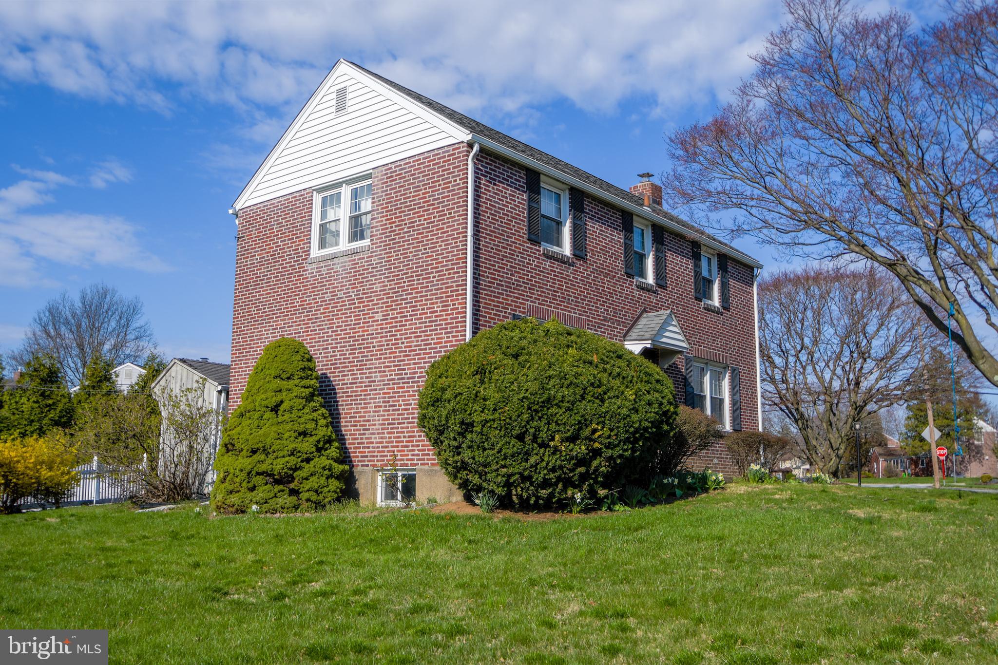 616 Wayne Avenue Springfield, PA 19064 - Photo 3 of 33 a front view of a house with a garden