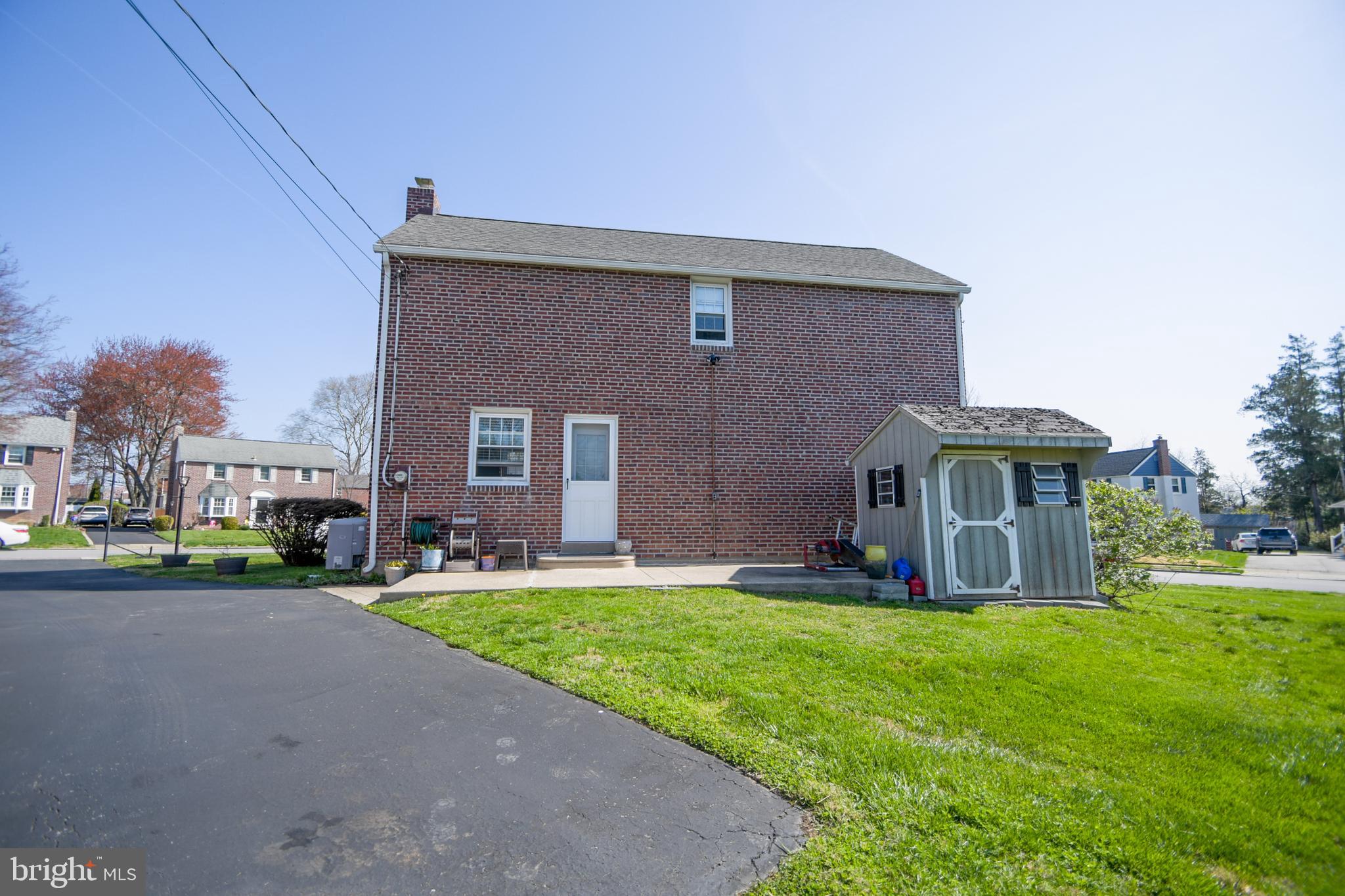 616 Wayne Avenue Springfield, PA 19064 - Photo 5 of 33 a front view of a house with a yard and garage