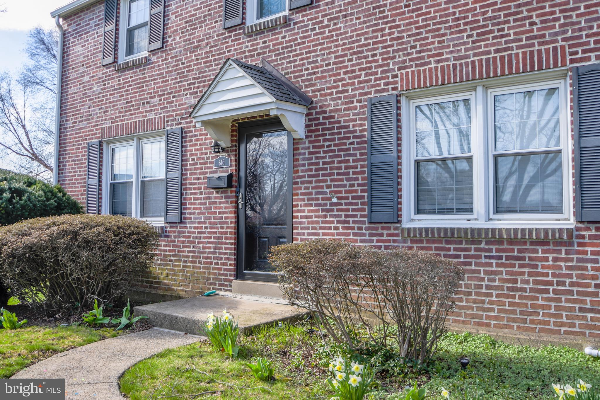 616 Wayne Avenue Springfield, PA 19064 - Photo 8 of 33 a front view of a house with a garden