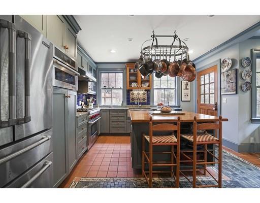 213 Brattle Street Cambridge, MA 02138 - Photo 11 of 30 a dining room with furniture a chandelier and kitchen view