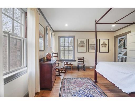 213 Brattle Street Cambridge, MA 02138 - Photo 23 of 30 a bedroom with furniture and a wooden floor