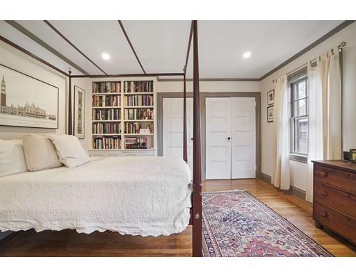 213 Brattle Street Cambridge, MA 02138 - Photo 24 of 30 a spacious bedroom with a bed and a window