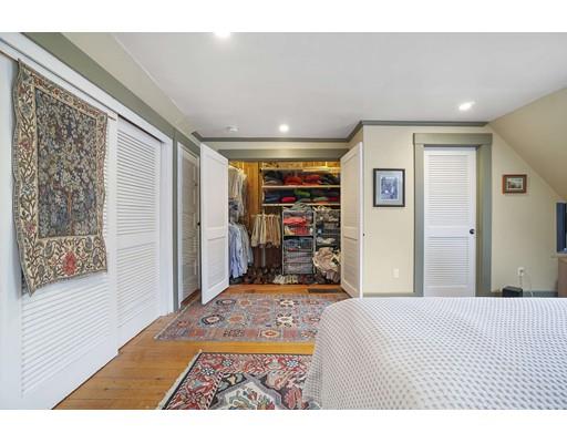 213 Brattle Street Cambridge, MA 02138 - Photo 25 of 30 a bedroom with a bed a dresser and a large mirror