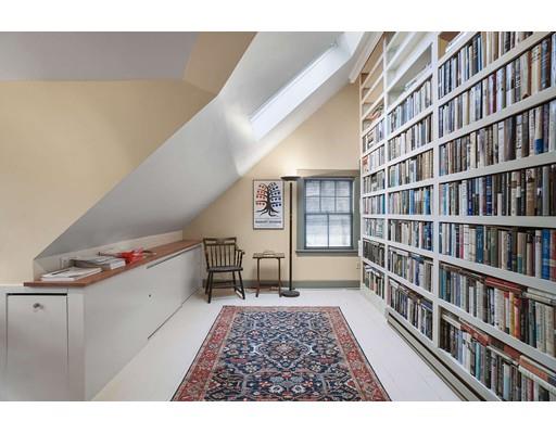 213 Brattle Street Cambridge, MA 02138 - Photo 30 of 30 a living room with a couch and bookshelf