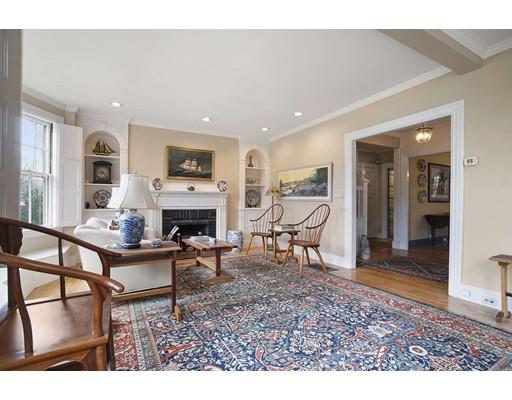 213 Brattle Street Cambridge, MA 02138 - Photo 7 of 30 a living room with furniture a dining table and a fireplace