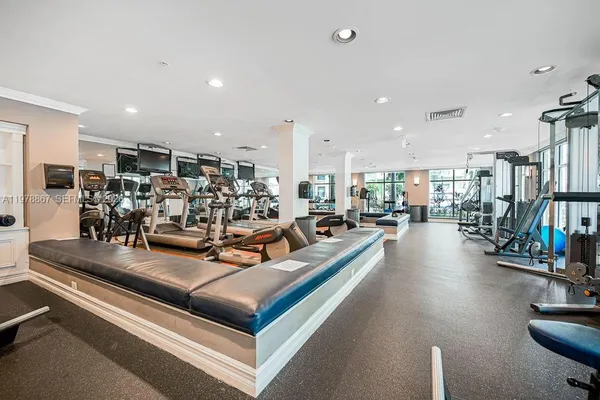 a view of a living room with gym equipment