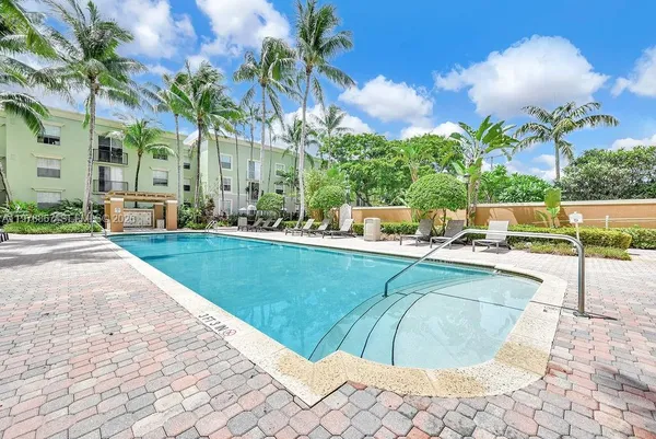a view of a swimming pool with a lounge chairs