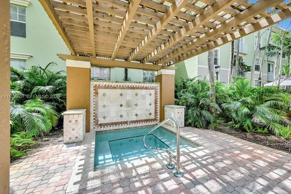 a view of a porch with a bench in patio