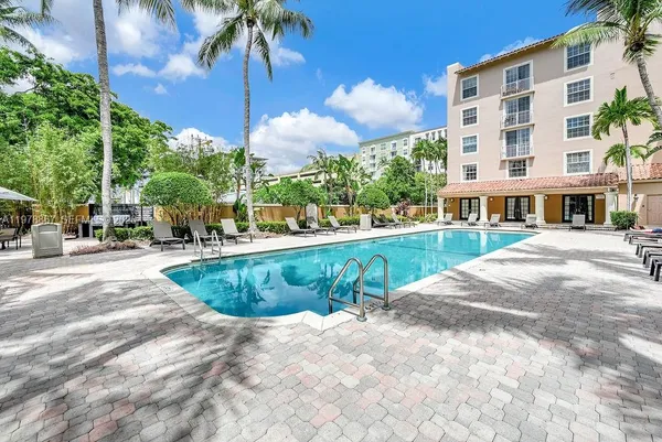 a view of a swimming pool with a patio
