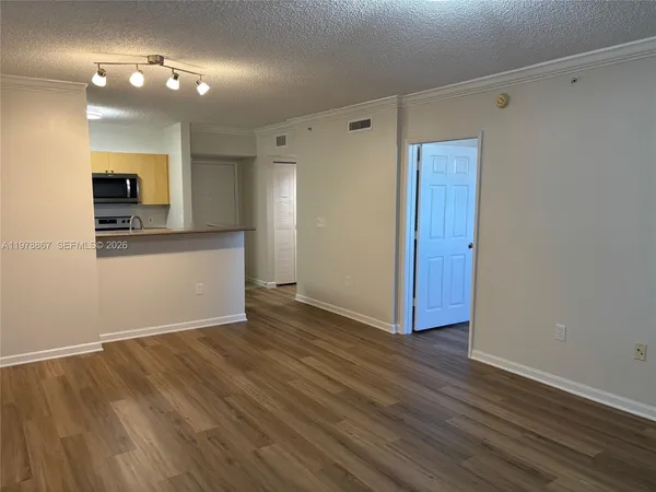 a view of kitchen with sink and wooden floor