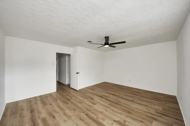a view of a big room with wooden floor