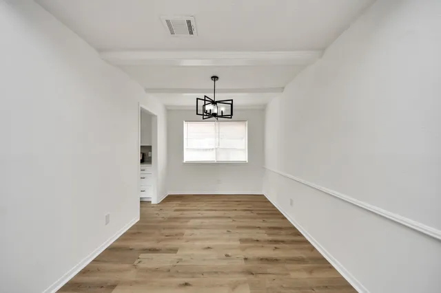 a view of an empty room and window