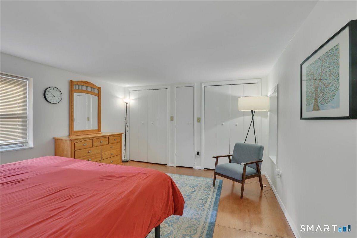 5 Seminole Trail East Hampton, CT 06424 - Photo 12 of 22 a bedroom with a bed and a table in it