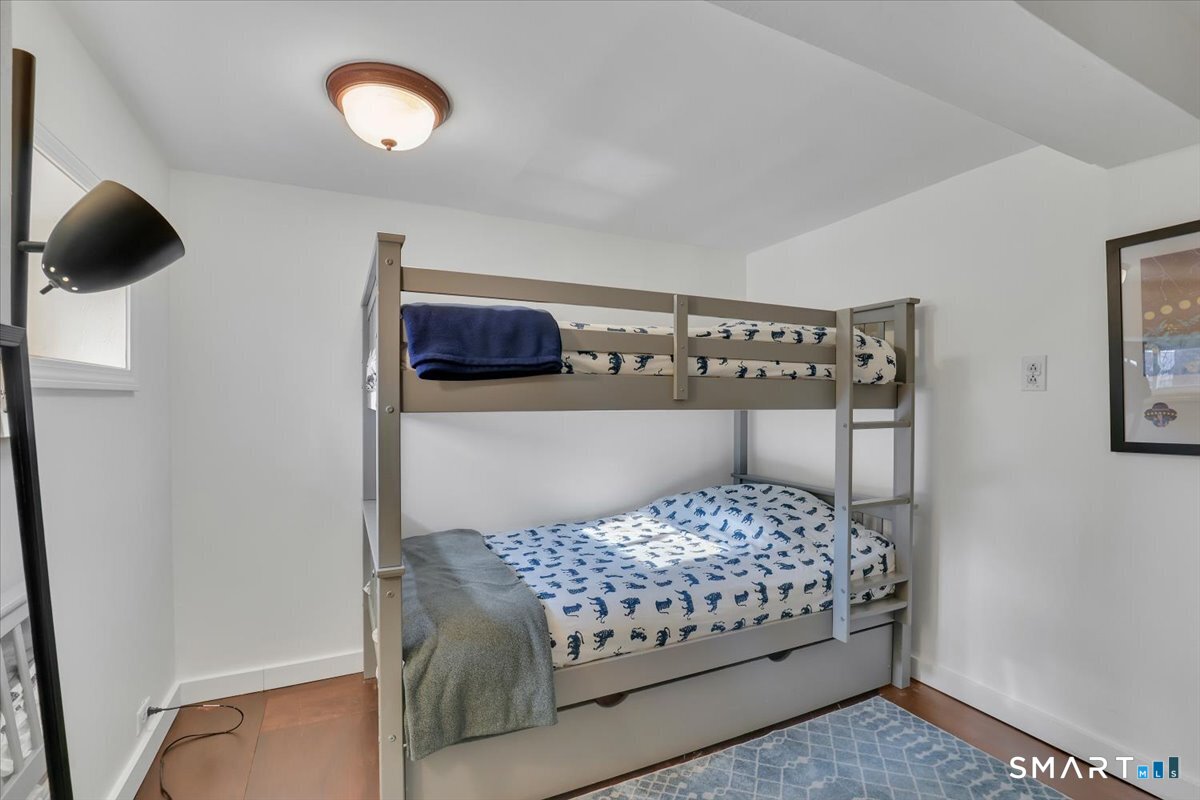 5 Seminole Trail East Hampton, CT 06424 - Photo 14 of 22 a bedroom with a bed and a chandelier