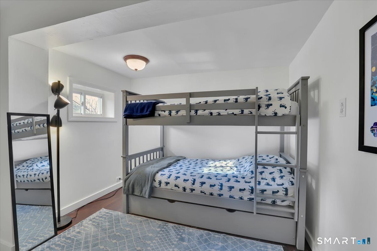 5 Seminole Trail East Hampton, CT 06424 - Photo 15 of 22 a bedroom with a bed and lamp