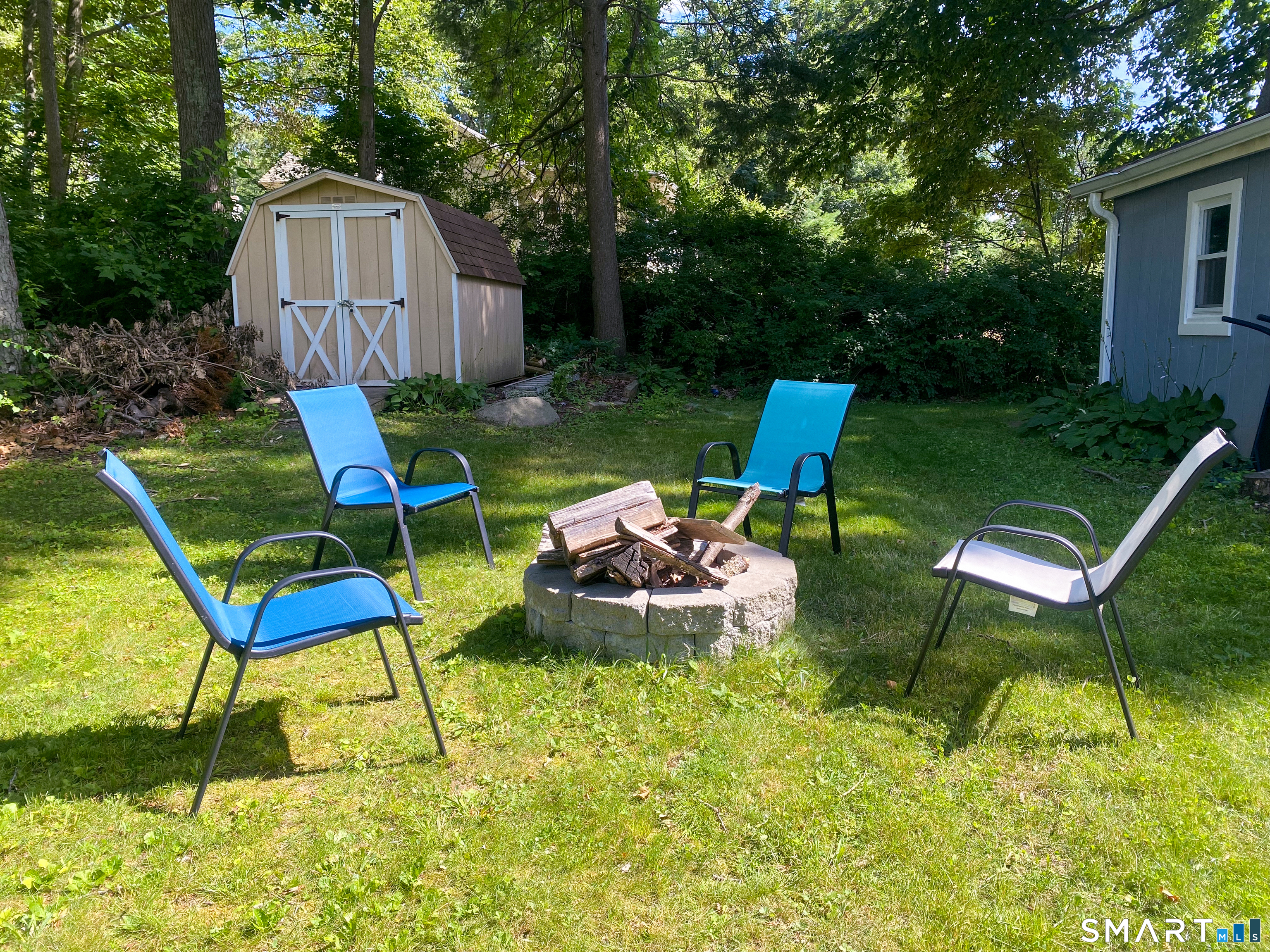 5 Seminole Trail East Hampton, CT 06424 - Photo 19 of 22 a view of a backyard with chairs and plants