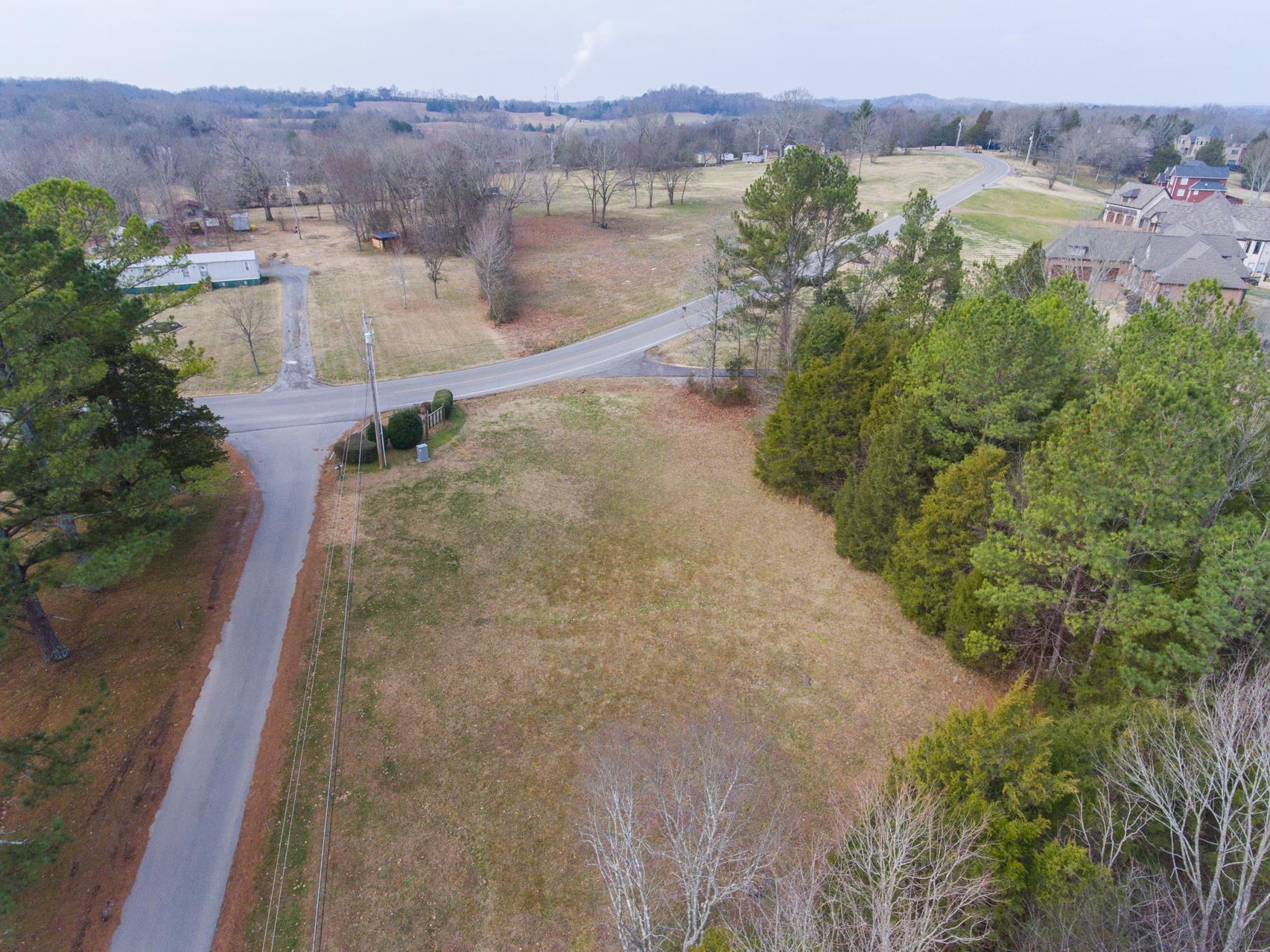 703 Pebble Point Road Lebanon, TN 37087 - Photo 17 of 21 an aerial view of a house with a yard